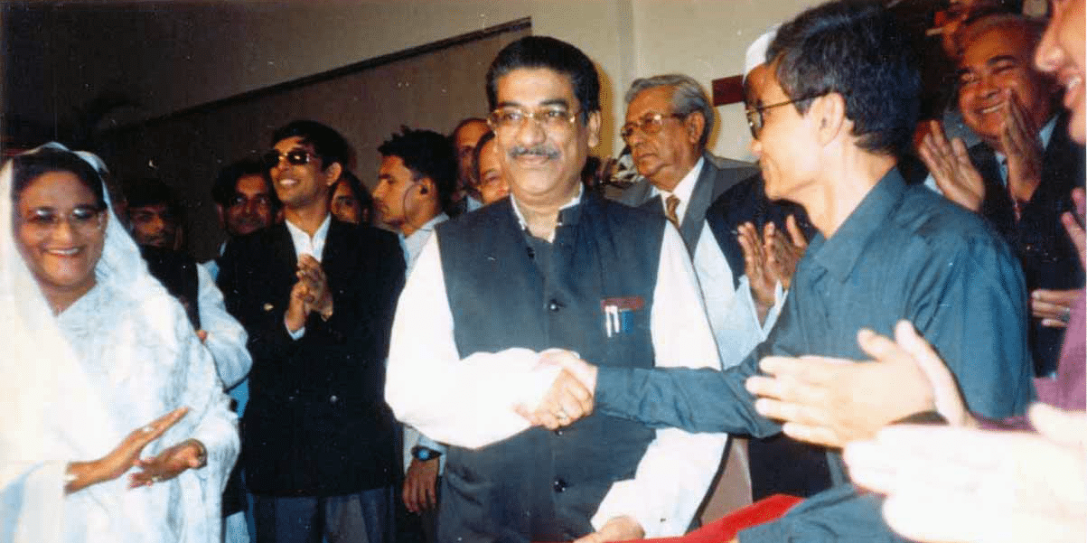 Formal exchange of CHT Accord papers between Mr. Abul Hasnat Abdullah, Convener of National Committee on CHT Affairs and Mr. Jyotirindra Bodhipriya Larma, President of PCJSS, signed on 2 December 1997 in Dhaka. Prime Minister Sheikh Hasina is seen applauding among others